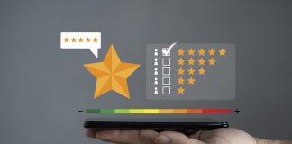 Smartphone screen with gold five star rating feedback