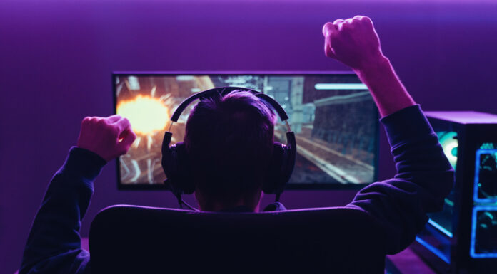 Gamer wearing headset while playing