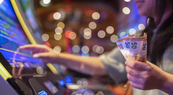 Female Gambler Hand hold money bill ready to win the game with one best shot casino