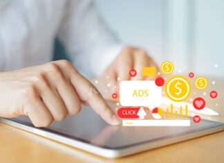Mastering Local PPC: Proven Tactics to Boost Conversions in Your Area Close up businessman hand touch screen on digital tablet checking traffic research of pay per click program on web page for online business