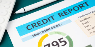 The Role of Authorized User Tradelines in Credit Repair Strategies Credit score report and calculator on the desk.