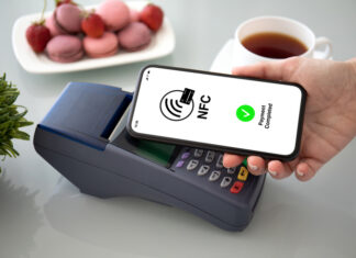 Female hands phone pay wireless technology nfc via pos terminal