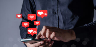 Man using smart phone with Social Media icon