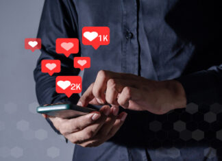 Man using smart phone with Social Media icon