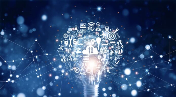 Hand holding light bulb and business digital marketing innovation technology icons