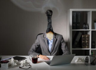 The Role of Leadership in Combating Burnout: How Effective Talent Management Starts at the Top Burnout woman working at the office