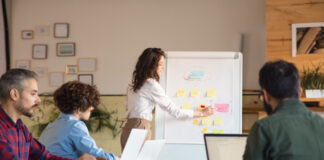 Membership Management: A Key to Donor Retention in the Nonprofit Sector Female manager drawing on whiteboard