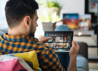 Male choosing movie online