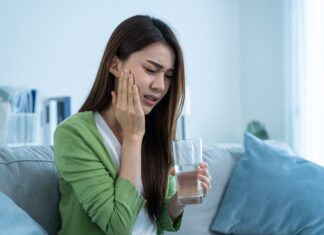 Does Suboxone Actually Cause Tooth Decay? Asian beautiful woman feel terrible toothache after drink cold water.