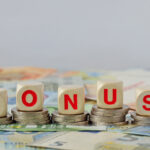 How No Deposit Bonuses Shape Young People’s Gambling Habits? Wooden blocks with the word Bonus on coins and banknotes