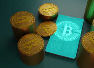 Bitcoin cryptocurrency with pile of coins and smartphone