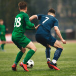 Measuring Player Impact in Live Football League Games: Quantifying On-Field Contributions Adult football competition. Soccer football player dribbling a ball and kick a ball during match in the stadium