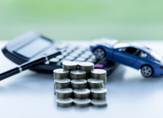 coins stack, car and calculator