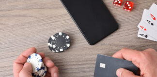 The Problems that Affect High Rollers But Not Regular Gamblers Casino game player accessing payment card to make virtual bets