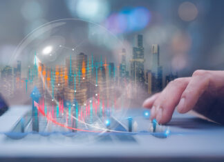 Businessman using computer working at virtual trading graph
