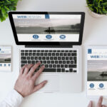 Smartphone and laptop showing web design website.