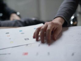 Hand on Top of Paper