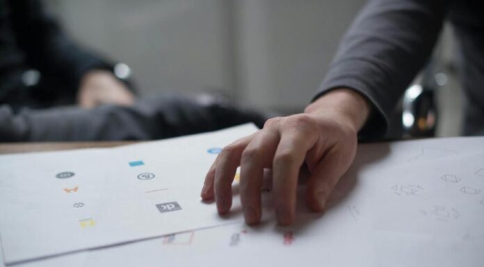 Hand on Top of Paper