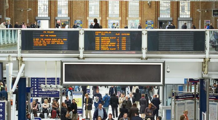 People walking through a train station