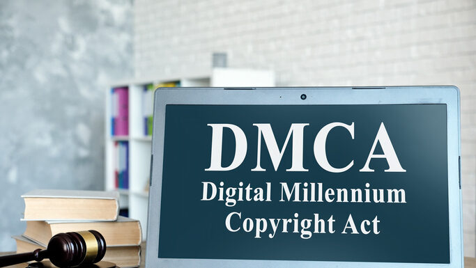 How Hosting Providers Navigate the Complexities of Copyright Protection DMCA Digital Millennium Copyright Act on laptop and gavel.