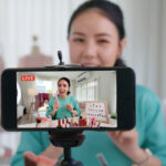 Driving Business Growth with Live Streaming Using OneStream Live Businesswoman live streaming her make up product