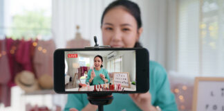 Driving Business Growth with Live Streaming Using OneStream Live Businesswoman live streaming her make up product