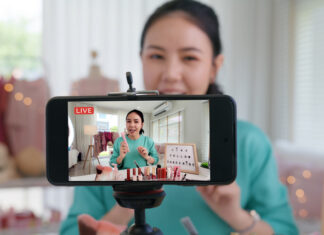 Businesswoman live streaming her make up product