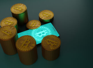 Bitcoin cryptocurrency with pile of coins and smartphone