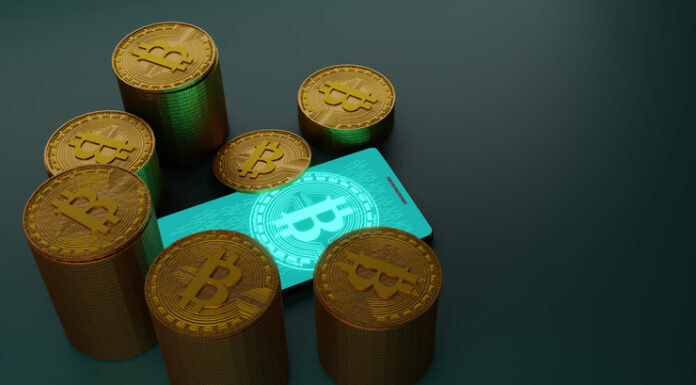 What Newcomers Need to Know When Playing in Crypto Casinos? Bitcoin cryptocurrency with pile of coins and smartphone