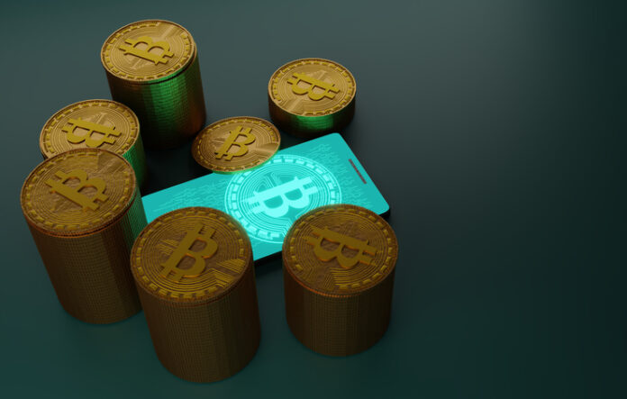 Bitcoin cryptocurrency with pile of coins and smartphone,3D rendering Bitcoin cryptocurrency with pile of coins and smartphone