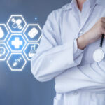 Hand of doctor hold a stethoscope with health icon.