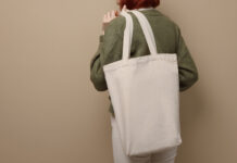 Stand Out at Events: Custom Cotton Tote Bags That Make a Statement woman with tote bag