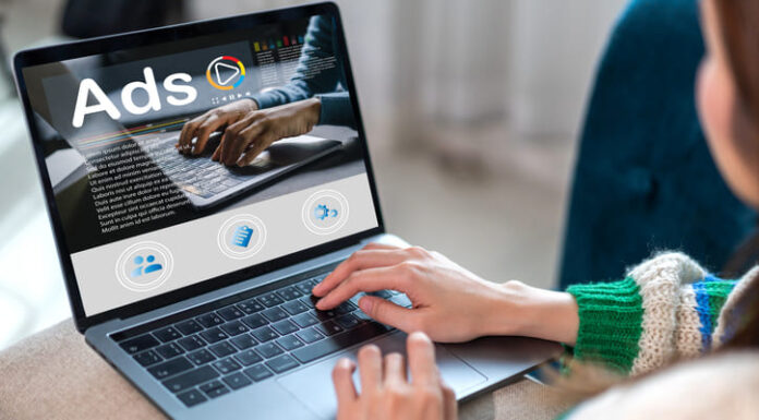 Woman using laptop with advertising Ads on computer