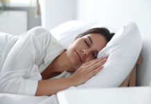 India’s Best Mattresses for Stress-Free Sleep: A Guide to Comfort Beautiful young woman sleeping on soft pillow in bed at home