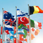Set of flags fluttering in the wind against blue sky