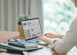 How EHS Software Streamlines Auditing Businesswoman accountant using a calculator and computer
