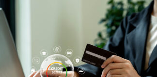 The Role of Credit Scores in Personal Finance and How to Improve Yours Businesswoman using laptop with credit score for student loan, mortgage and payment cards.