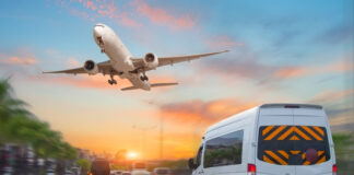 Exploring Efficient Airport Transportation: Best Coach Services for Midway Arrivals Mini bus drives along the highway among other cars in the evening in the sunset sky