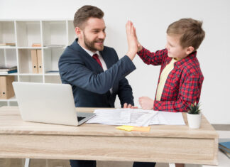 White collar worker with son at office