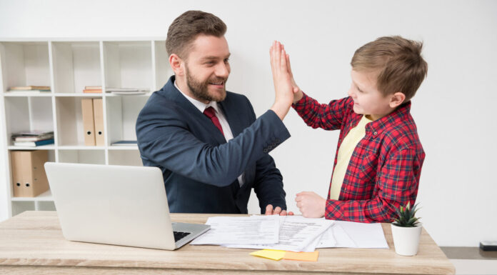 White collar worker with son at office