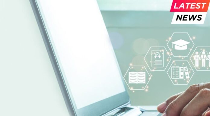 Hands of a man typing on a laptop keyboard Business Team