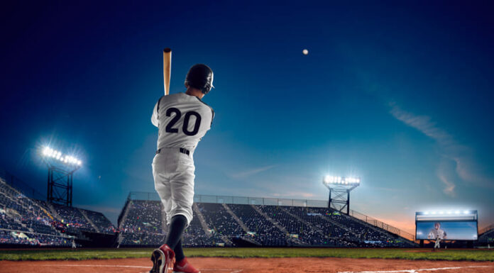 Baseball Popularity in Southeast Asia: Trends and Predictions Baseball player at professional baseball stadium in evening during a game.