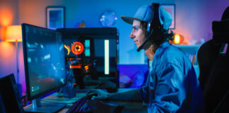 Key Factors to Consider Before Buying a Gaming PC Professional Gamer Playing First-Person Shooter Online Video Game on His Powerful Personal Computer