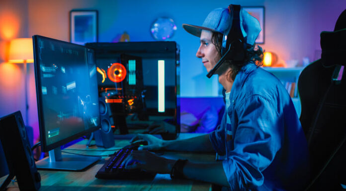 Professional Gamer Playing First-Person Shooter Online Video Game on His Powerful Personal Computer