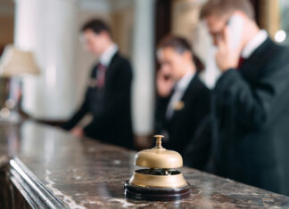 Why the Right Staffing Partner is Essential for Hospitality Success Hotel service bell at reception counter desk