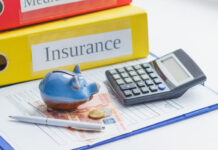 Using a Term Insurance Calculator to Estimate Coverage Needs Clean insurance form, piggy bank, calculator and money