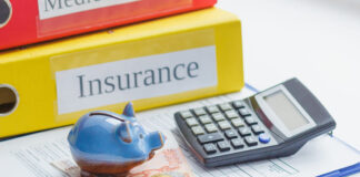 Using a Term Insurance Calculator to Estimate Coverage Needs Clean insurance form, piggy bank, calculator and money