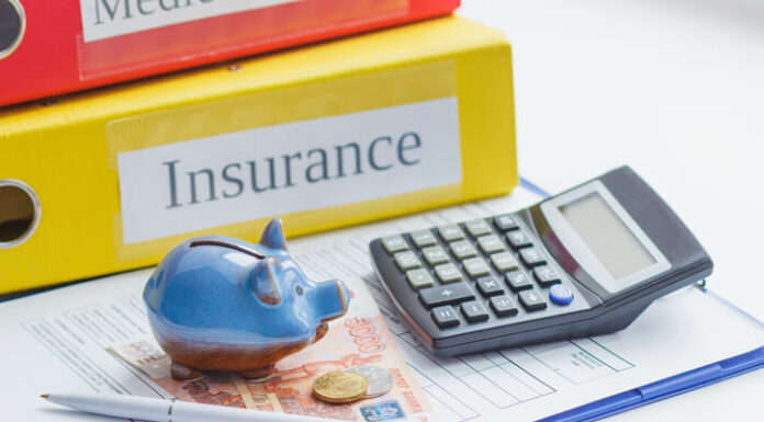 Clean insurance form, piggy bank, calculator and money