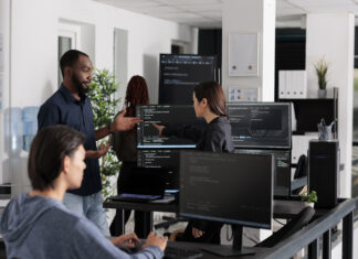 The Competitive Edge of Having a Dedicated Software Development Team App software developer typing machine learning html code