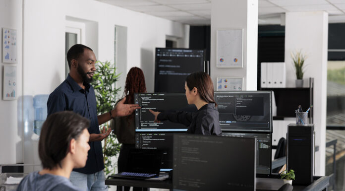 The Competitive Edge of Having a Dedicated Software Development Team App software developer typing machine learning html code